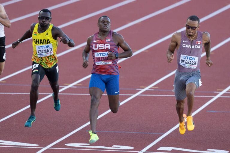 USA sprinter competing in an international track and field race, showcasing elite speed, focus, and athletic performance on the world stage.