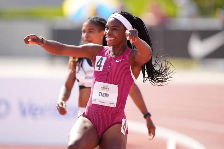 Track and field sprinter celebrating after a race victory, showcasing athletic excellence and competitive spirit at an elite track event.