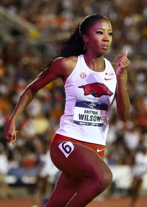 Track and field sprinter in competition showing speed, focus, and power, representing elite athletic performance and dedication to excellence.